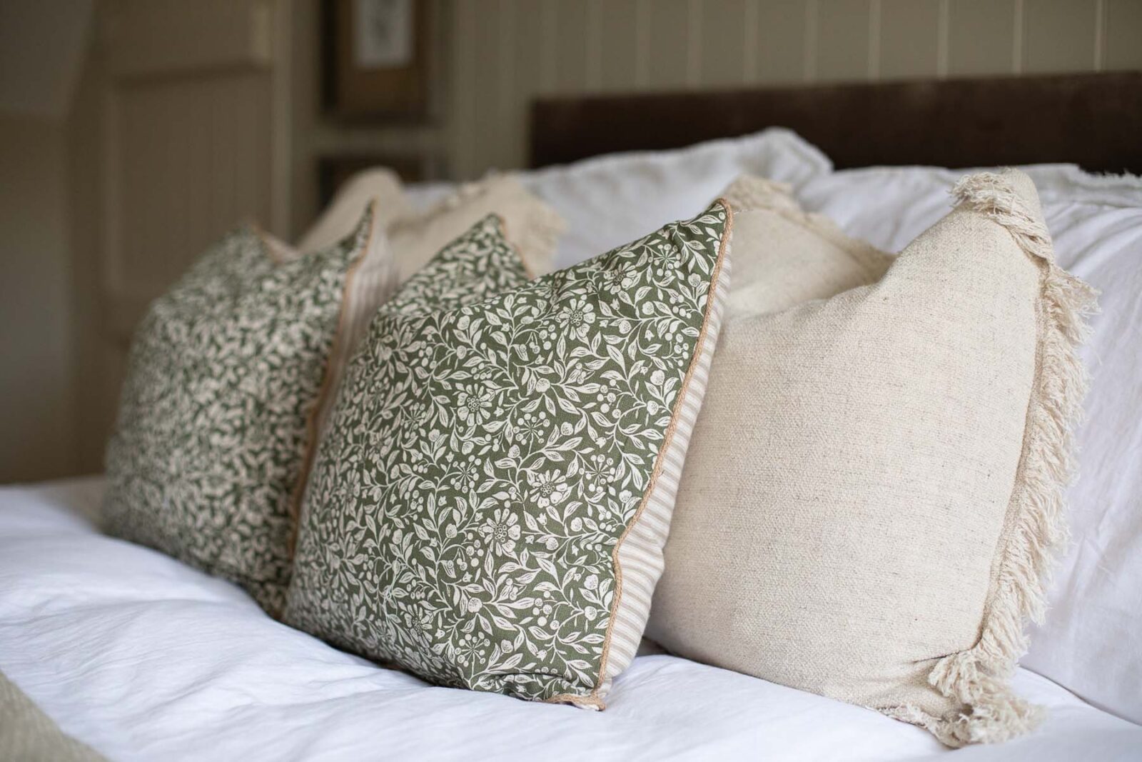 close up of cushions on bed