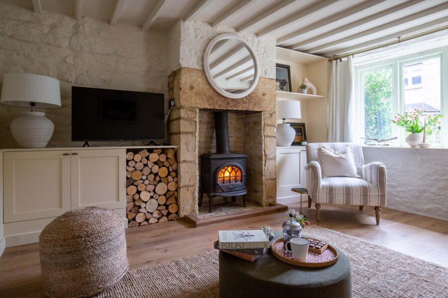 sitting with log burner and wood