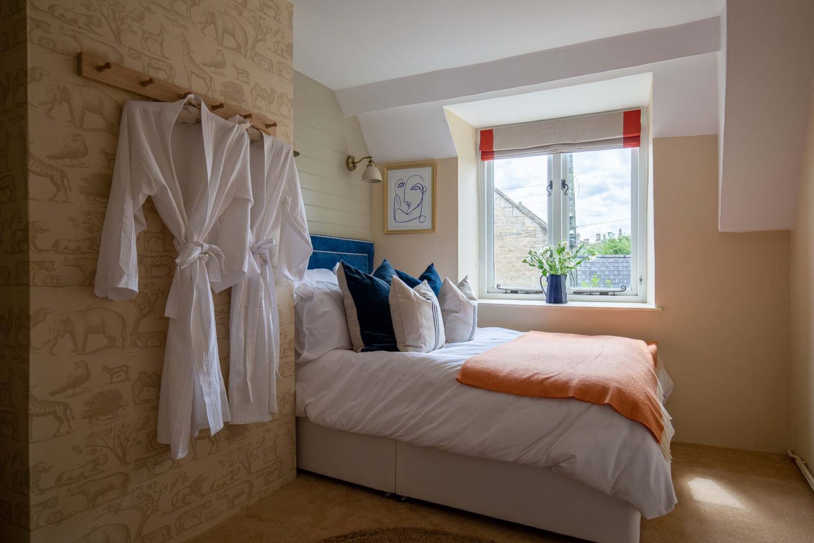 bedroom with hanging dressing gowns