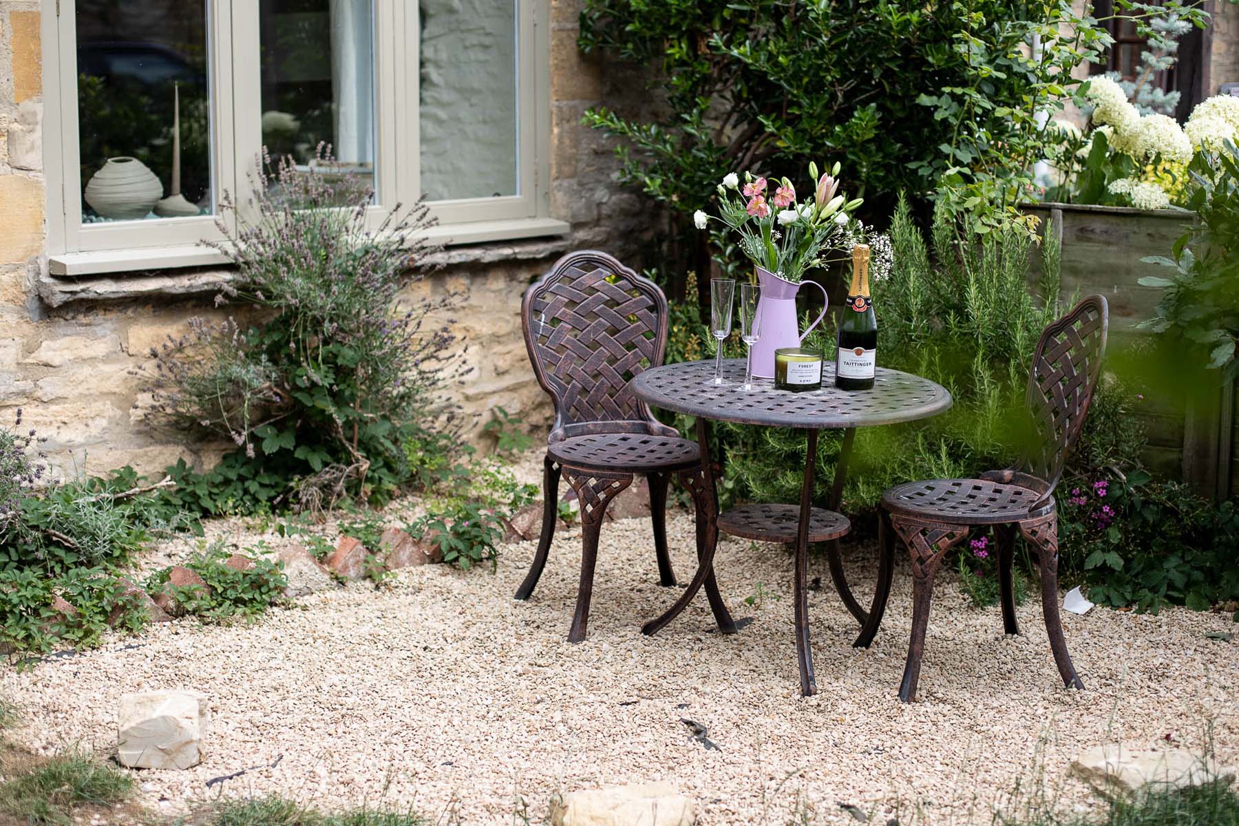 outdoor table and chairs in garden