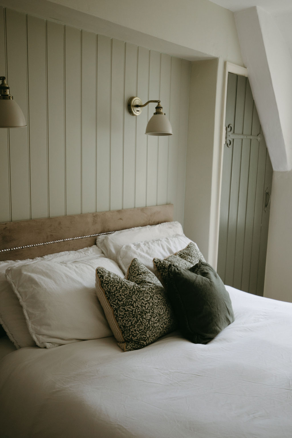 cushions on bed in bedroom