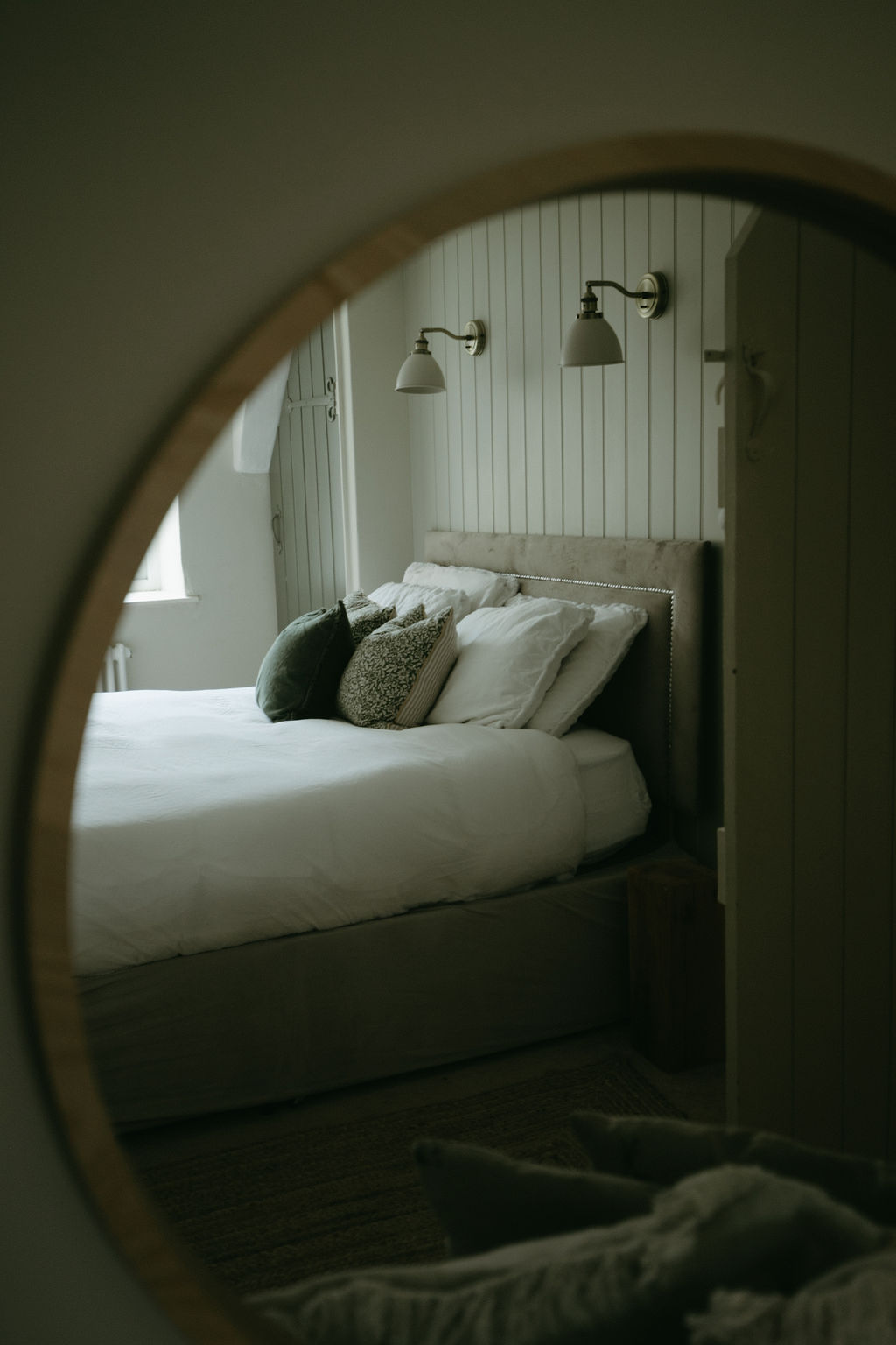 bed reflection in mirror