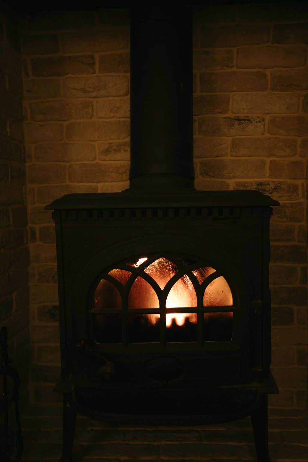log burner alight at dusk