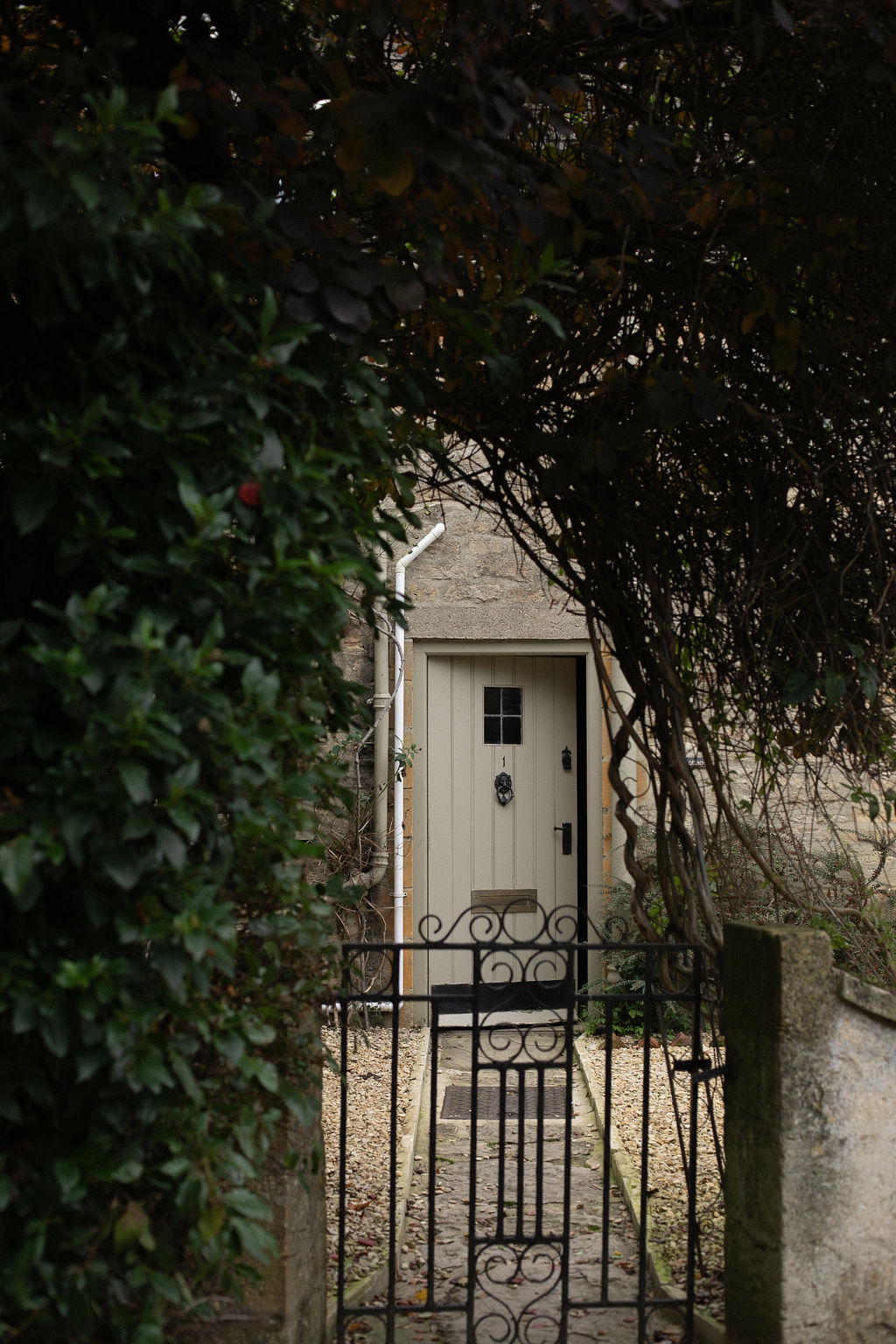 cottage door with pathway and gate