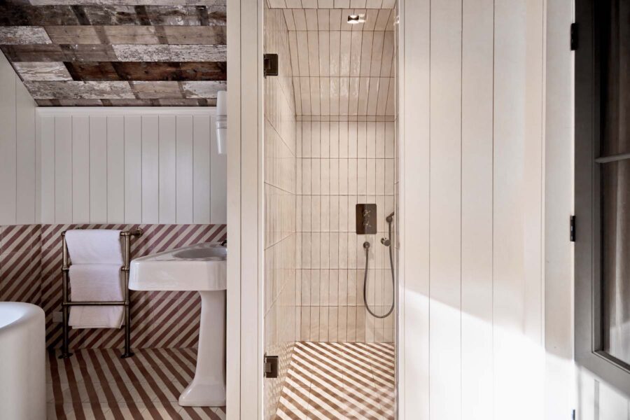 Walk in rainfall shower and view into bathroom