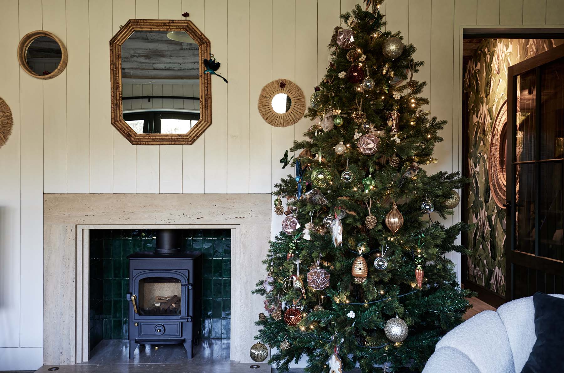 Log burner with overhead mirror and Christmas tree