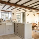 kitchen with wooden beams and dining table