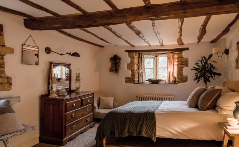 bedroom with wooden ceiling beams