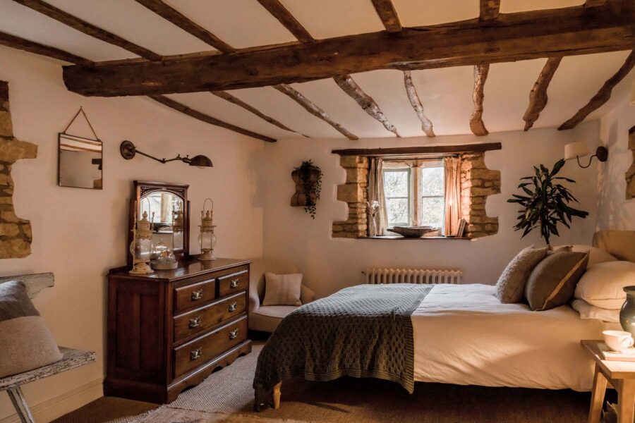 bedroom with wooden ceiling beams
