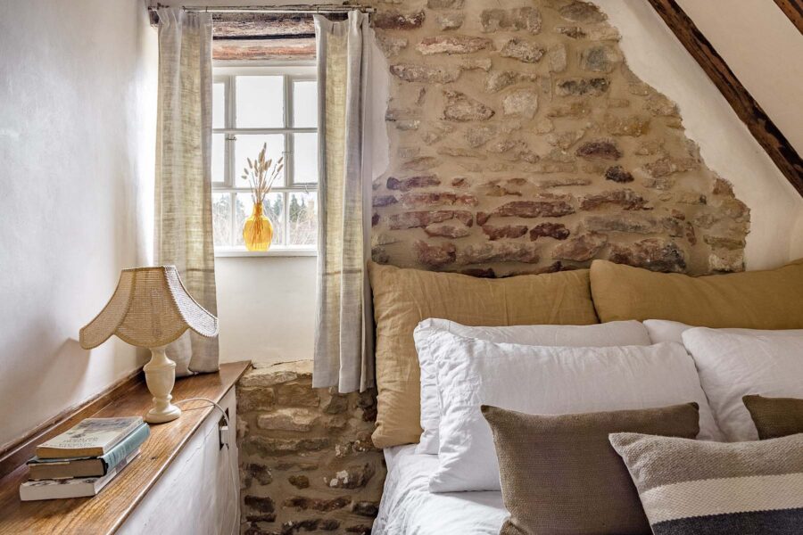 Bedroom with exposed stone walls