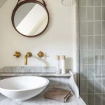 Modern neutral bathroom sink with marble vanity unit