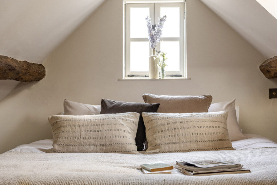 Cosy bedroom with neutral decor in the eaves