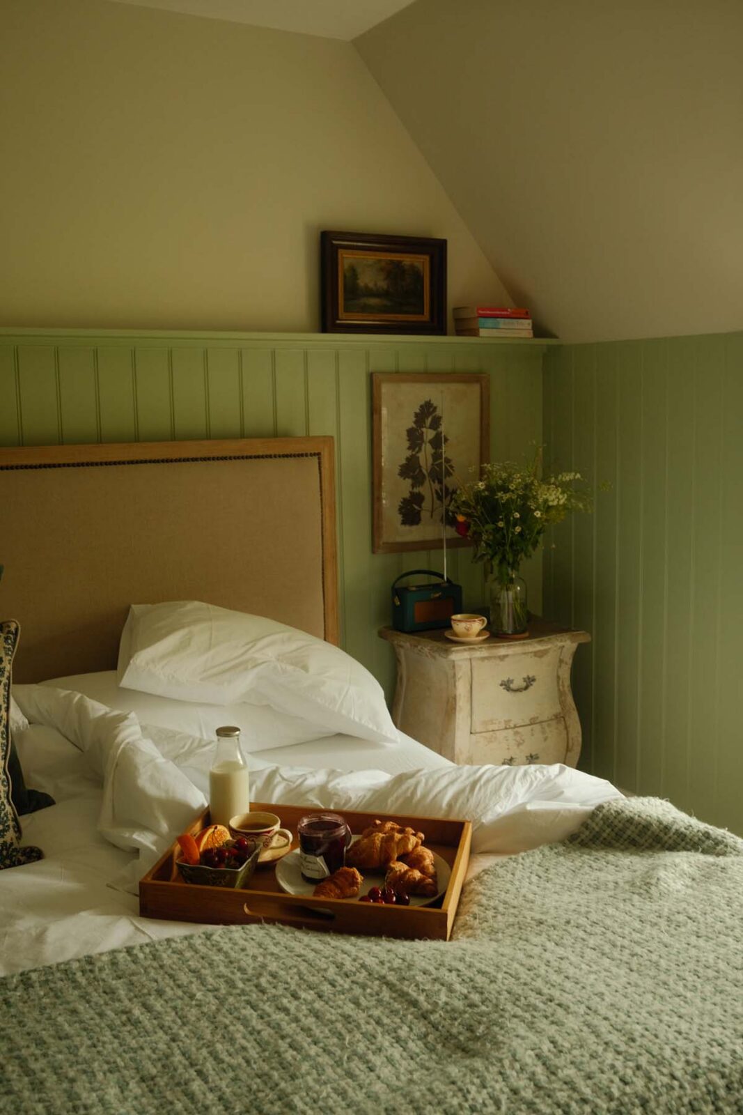 messy bed with breakfast tray