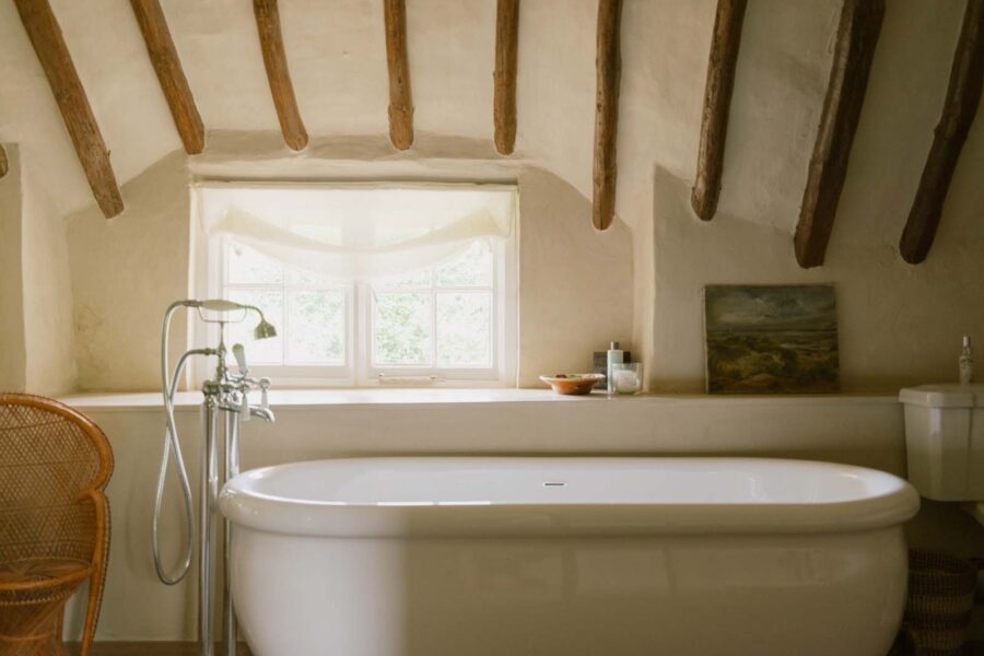 free standing bath tub with over head beams