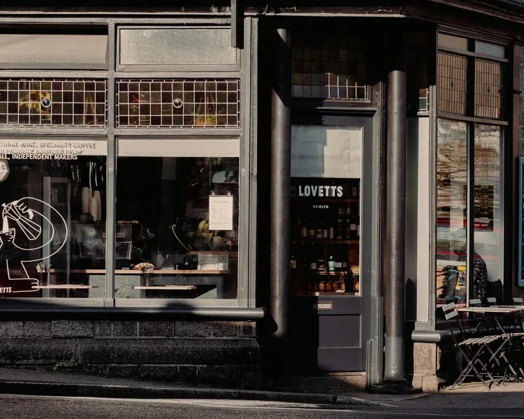Cafe front from the roadside painted in black.