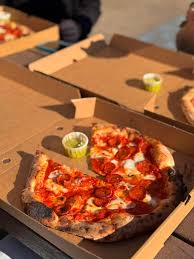 Pizza in a takeaway box