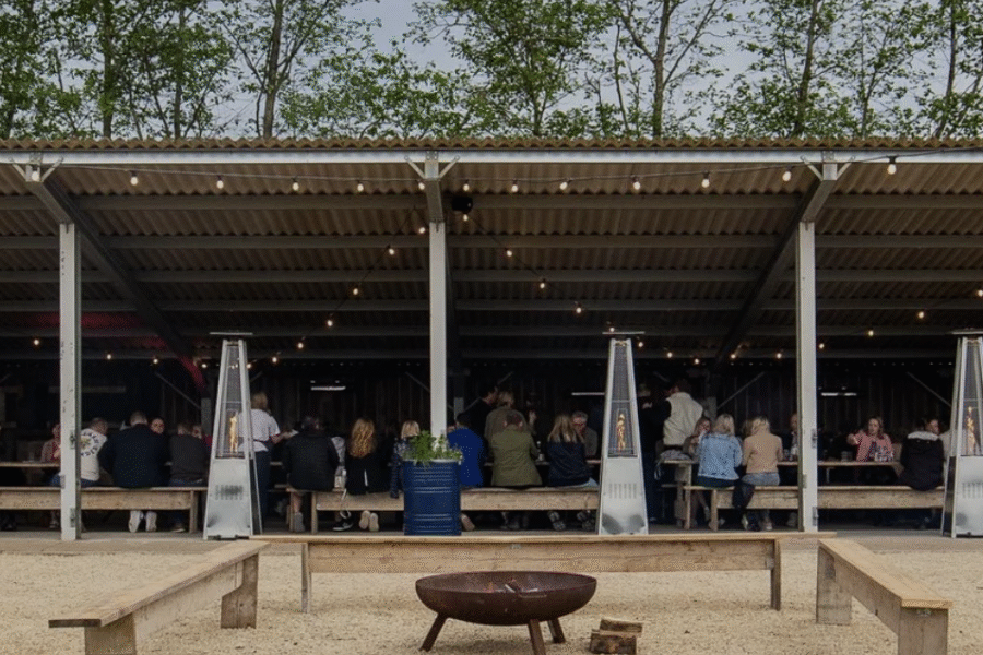 Outdoor barn dining by a fire pit