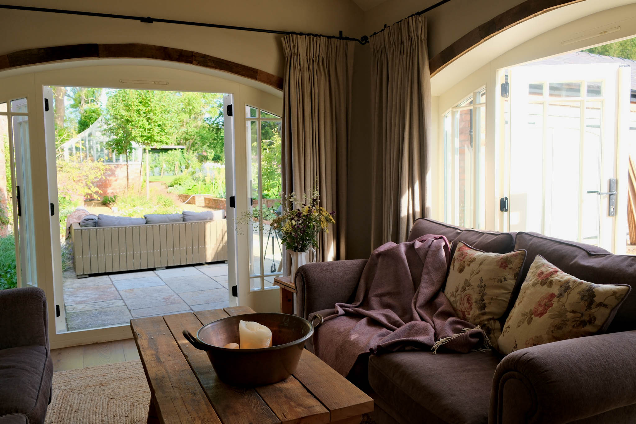 living room with doors open out to the garden