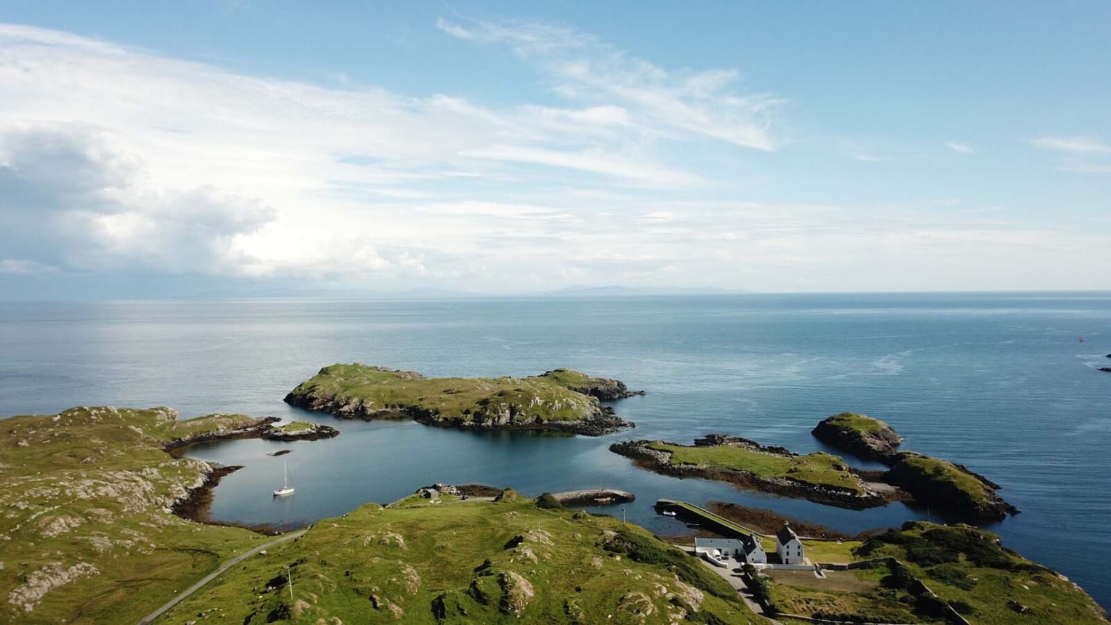 drone shot of island and sea beyond