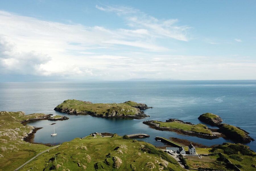 drone shot of island and sea beyond